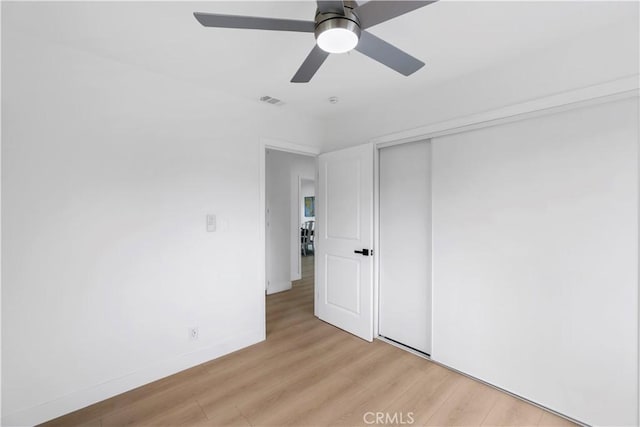 2218 S Meridian Ave, Alhambra, CA 91803 - unfurnished bedroom with light wood-style flooring, a closet, a ceiling fan, and baseboards