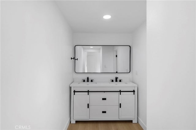 2218 S Meridian Ave, Alhambra, CA 91803 - bathroom featuring double vanity, baseboards, wood finished floors, and recessed lighting
