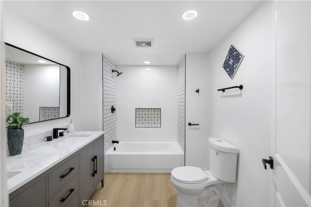 2218 S Meridian Ave, Alhambra, CA 91803 - full bathroom featuring toilet, double vanity, shower / tub combination, wood finished floors, and recessed lighting