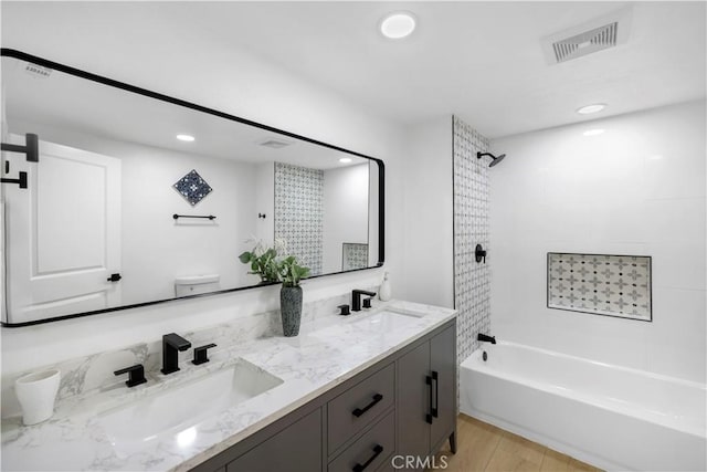 2218 S Meridian Ave, Alhambra, CA 91803 - full bathroom featuring double vanity, tub / shower combination, recessed lighting, wood finished floors, and toilet