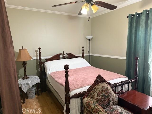 14533 Cameo Ave, Norwalk, CA 90650 - bedroom with crown molding, wood finished floors, and ceiling fan
