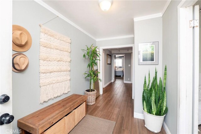 14121 Calais St, Baldwin Park, CA 91706 - hallway featuring wood finished floors, ornamental molding, and baseboards