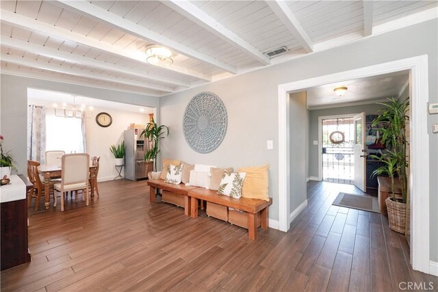 14121 Calais St, Baldwin Park, CA 91706 - corridor featuring beam ceiling, wood finished floors, a chandelier, and baseboards
