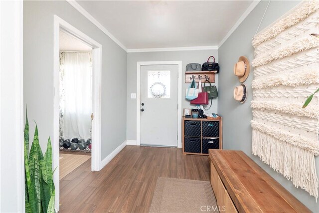 14121 Calais St, Baldwin Park, CA 91706 - foyer entrance with wood finished floors, crown molding, healthy amount of natural light, and baseboards
