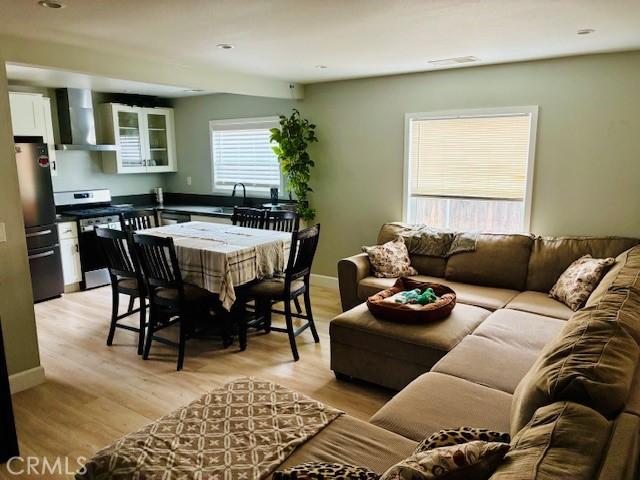 3535 N Mountain View Ave, San Bernardino, CA 92405 - living area with light wood-style floors and baseboards