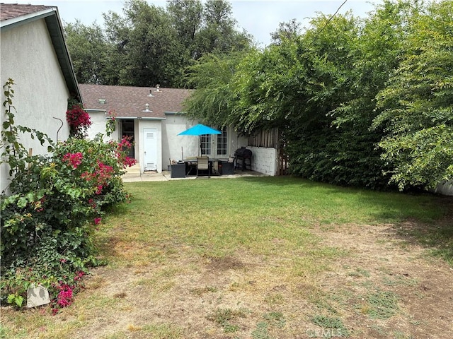 3535 N Mountain View Ave, San Bernardino, CA 92405 - view of green lawn with a patio area and an outdoor living space