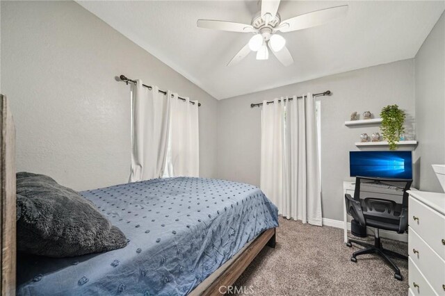8167 Vineyard Ave Unit 109, Rancho Cucamonga, CA 91730 - carpeted bedroom featuring lofted ceiling, a desk, ceiling fan, and baseboards