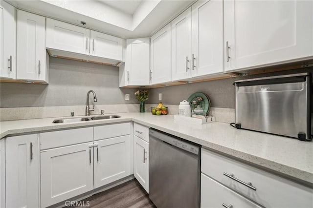 8167 Vineyard Ave Unit 109, Rancho Cucamonga, CA 91730 - kitchen featuring stainless steel dishwasher, a sink, white cabinetry, and light stone countertops