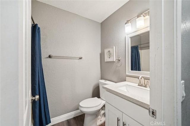 8167 Vineyard Ave Unit 109, Rancho Cucamonga, CA 91730 - full bath featuring vanity, wood finished floors, toilet, a shower with shower curtain, and a textured wall
