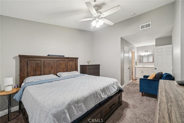 8167 Vineyard Ave Unit 109, Rancho Cucamonga, CA 91730 - carpeted bedroom with baseboards, connected bathroom, a ceiling fan, and a sink