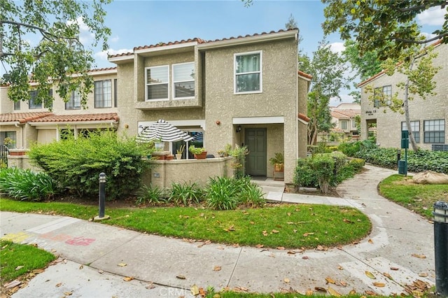 8167 Vineyard Ave Unit 109, Rancho Cucamonga, CA 91730 - view of property with stucco siding and a tile roof