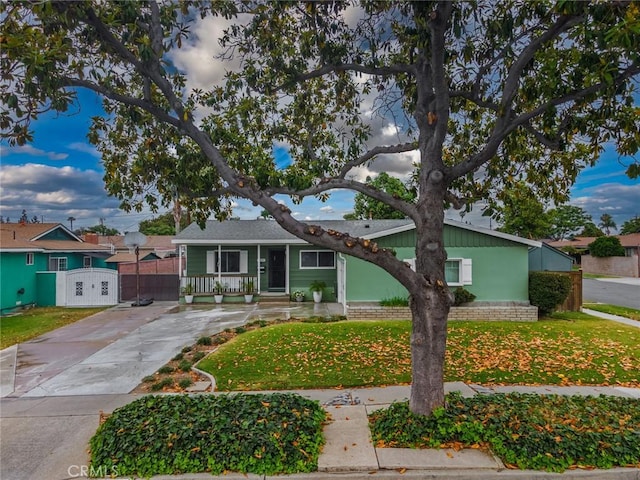 1501 W Baker Ave, Fullerton, CA 92833 - view of front of property featuring concrete driveway and covered porch