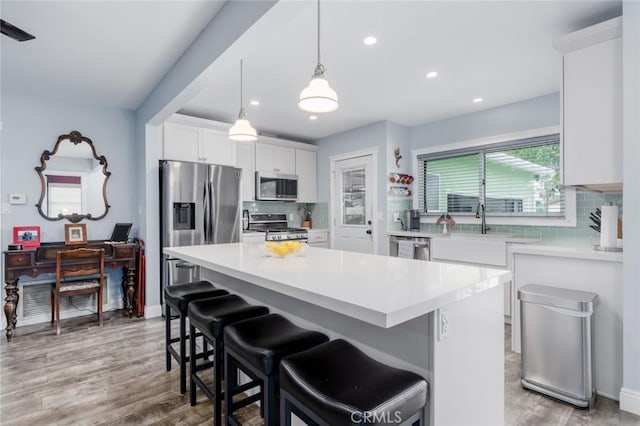 1501 W Baker Ave, Fullerton, CA 92833 - kitchen with appliances with stainless steel finishes, tasteful backsplash, white cabinets, light countertops, and recessed lighting