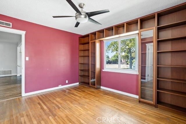 1501 W Baker Ave, Fullerton, CA 92833 - unfurnished bedroom featuring wood finished floors and ceiling fan