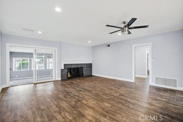 1501 W Baker Ave, Fullerton, CA 92833 - unfurnished living room with a ceiling fan, dark wood-type flooring, a brick fireplace, and recessed lighting