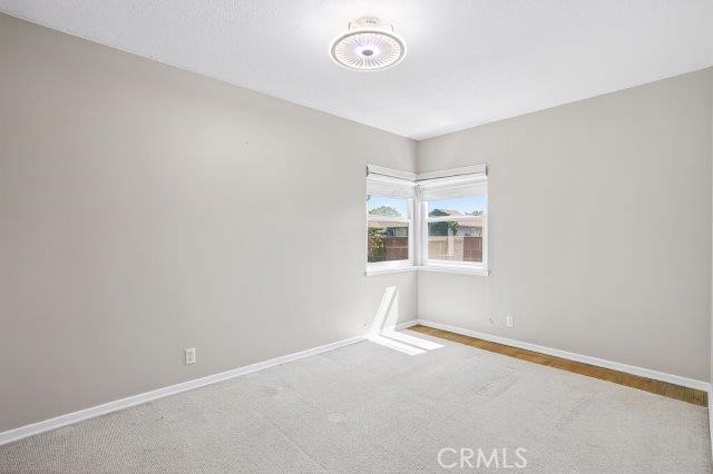 1501 W Baker Ave, Fullerton, CA 92833 - unfurnished room with carpet floors and baseboards