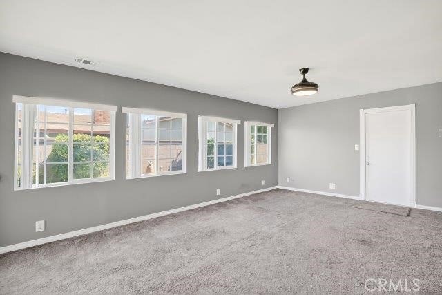 1501 W Baker Ave, Fullerton, CA 92833 - carpeted empty room with plenty of natural light