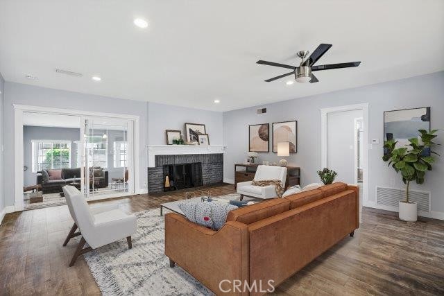 1501 W Baker Ave, Fullerton, CA 92833 - living area featuring ceiling fan, a fireplace, wood finished floors, and recessed lighting
