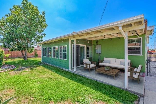 1501 W Baker Ave, Fullerton, CA 92833 - back of property with a patio area and an outdoor hangout area