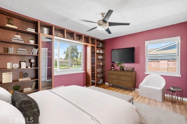 1501 W Baker Ave, Fullerton, CA 92833 - bedroom with a textured ceiling, wood finished floors, and a ceiling fan