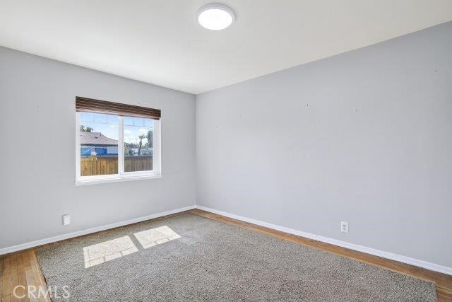 1501 W Baker Ave, Fullerton, CA 92833 - empty room with wood finished floors and baseboards