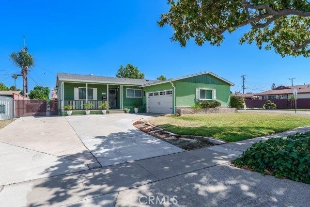 1501 W Baker Ave, Fullerton, CA 92833 - single story home featuring concrete driveway, a porch, and an attached garage