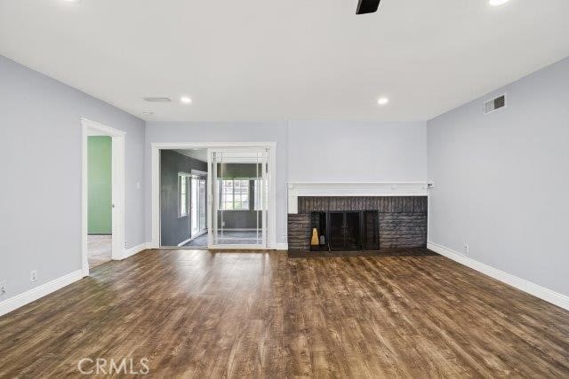1501 W Baker Ave, Fullerton, CA 92833 - unfurnished living room featuring wood finished floors, a fireplace, recessed lighting, and ceiling fan