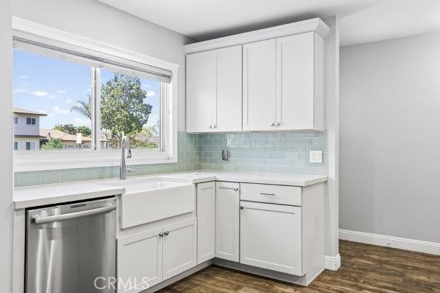 1501 W Baker Ave, Fullerton, CA 92833 - kitchen with stainless steel dishwasher, decorative backsplash, light countertops, and white cabinets
