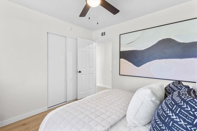 246 Aldama Ave, Pomona, CA 91767 - bedroom featuring wood finished floors, a closet, and a ceiling fan
