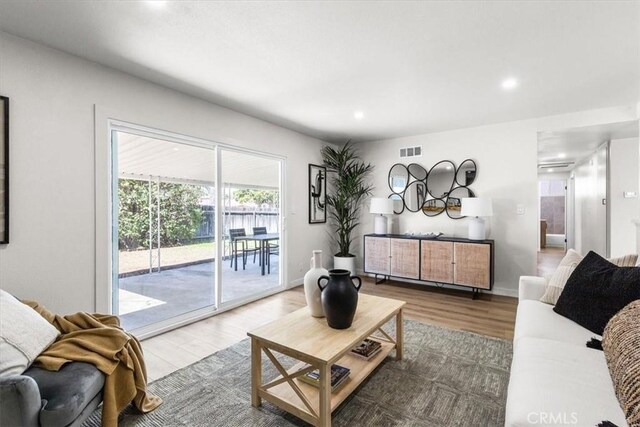 246 Aldama Ave, Pomona, CA 91767 - living room featuring wood finished floors and recessed lighting
