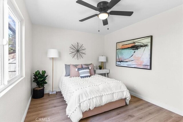 246 Aldama Ave, Pomona, CA 91767 - bedroom with wood finished floors and a ceiling fan