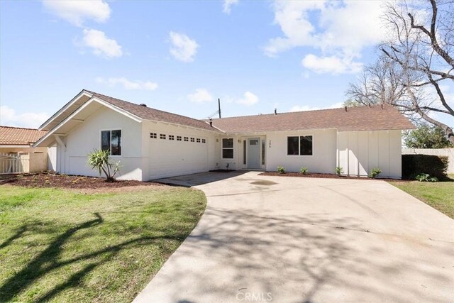246 Aldama Ave, Pomona, CA 91767 - ranch-style home with driveway, a garage, and stucco siding