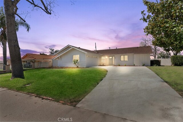 246 Aldama Ave, Pomona, CA 91767 - ranch-style home with concrete driveway, a garage, and stucco siding