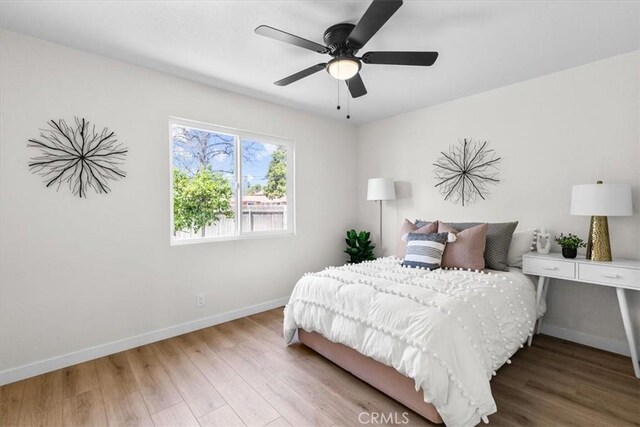 246 Aldama Ave, Pomona, CA 91767 - bedroom with wood finished floors and a ceiling fan