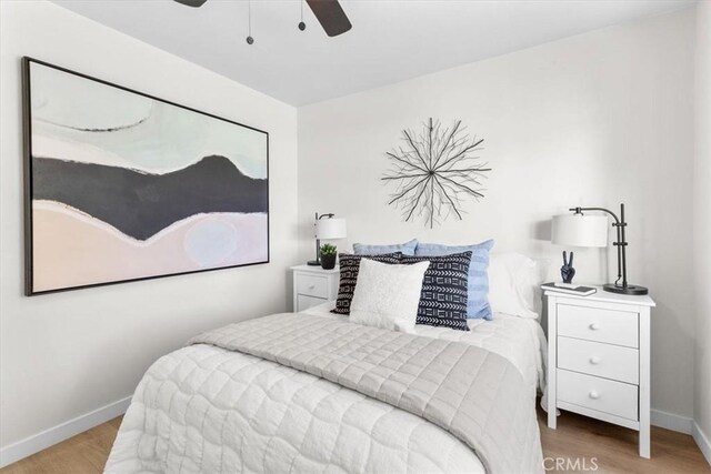 246 Aldama Ave, Pomona, CA 91767 - bedroom with wood finished floors and a ceiling fan