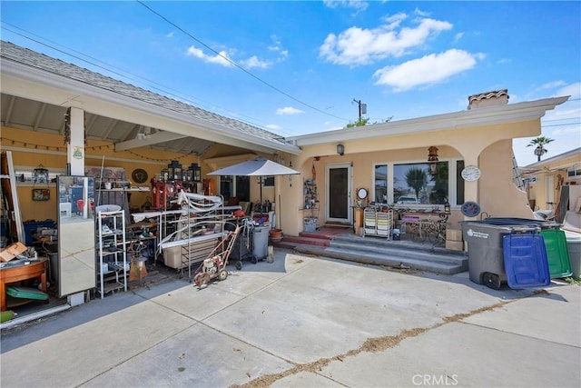 546 E 220th St, Carson, CA 90745 - rear view of property featuring stucco siding