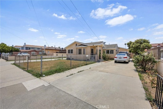 546 E 220th St, Carson, CA 90745 - view of front facade with concrete driveway and stucco siding