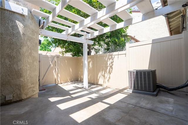 1643 Golden Tree Ct Unit C, Corona, CA 92879 - view of patio / terrace featuring central air condition unit, a pergola, and a gate