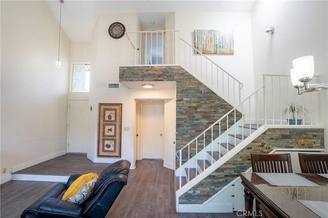 1643 Golden Tree Ct Unit C, Corona, CA 92879 - stairs with a high ceiling, wood finished floors, and baseboards