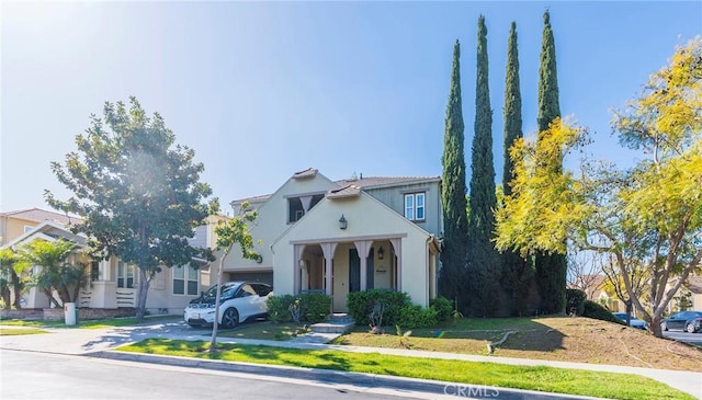 2290 Evans St, Fullerton, CA 92833 - view of front facade featuring a garage, stucco siding, and concrete driveway