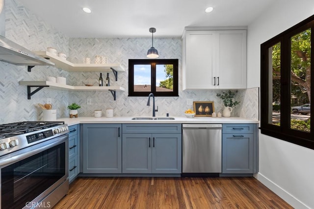 3556 Olive Ave, Long Beach, CA 90807 - kitchen with stainless steel appliances, a sink, open shelves, wall chimney exhaust hood, and light countertops