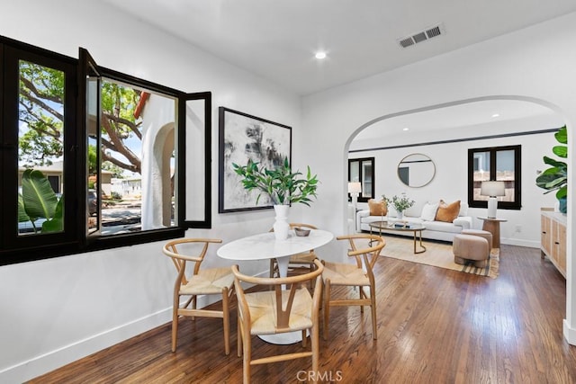 3556 Olive Ave, Long Beach, CA 90807 - dining area with arched walkways, wood finished floors, baseboards, and recessed lighting