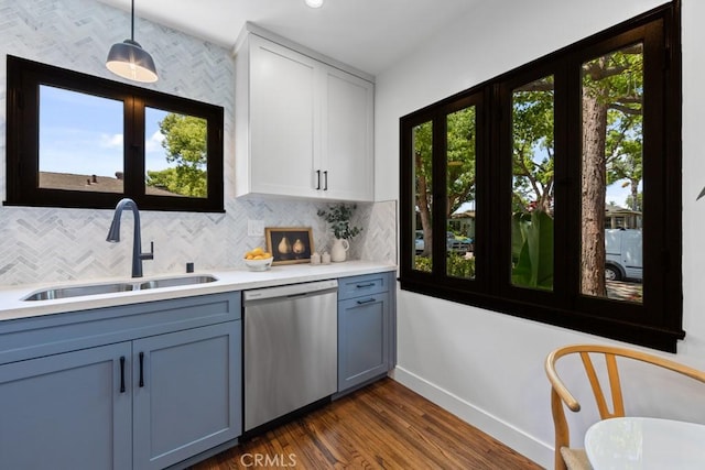 3556 Olive Ave, Long Beach, CA 90807 - kitchen featuring dishwasher, a sink, light countertops, baseboards, and backsplash