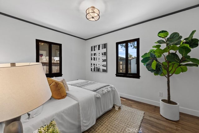 3556 Olive Ave, Long Beach, CA 90807 - bedroom with baseboards, wood finished floors, and crown molding