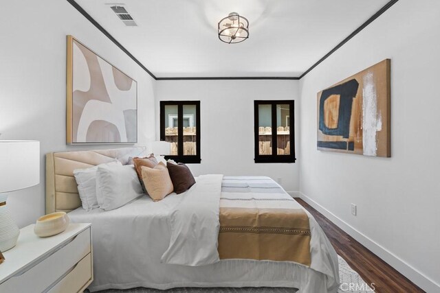 3556 Olive Ave, Long Beach, CA 90807 - bedroom with dark wood-style flooring, baseboards, and crown molding