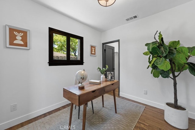 3556 Olive Ave, Long Beach, CA 90807 - home office featuring baseboards and wood finished floors