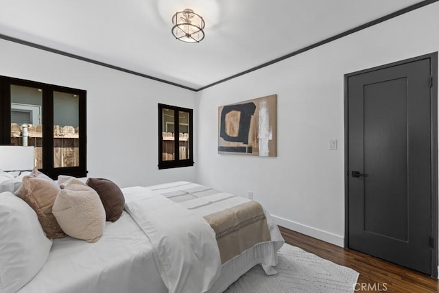 3556 Olive Ave, Long Beach, CA 90807 - bedroom featuring wood finished floors, baseboards, and crown molding