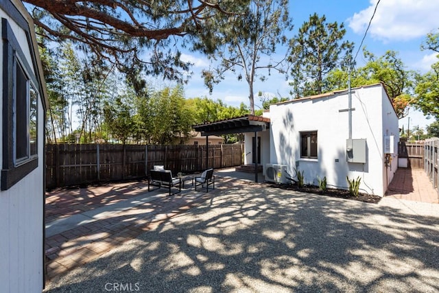 3556 Olive Ave, Long Beach, CA 90807 - rear view of house featuring a patio area, stucco siding, a fenced backyard, and a pergola