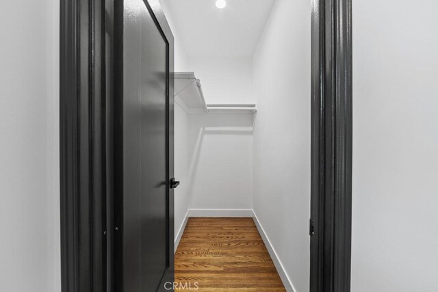 3556 Olive Ave, Long Beach, CA 90807 - walk in closet featuring wood finished floors