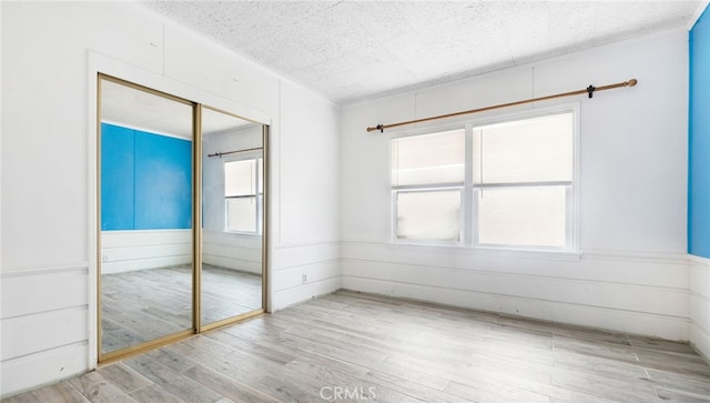 529 E Harvard Pl, Ontario, CA 91764 - unfurnished room featuring wood finished floors and a textured ceiling